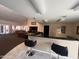 A community bar with granite counters, bar stool seating, and an attached rec room at 8260 E Arabian Trl # 275, Scottsdale, AZ 85258