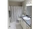 This bathroom features a granite countertop vanity and a shower and tub combination at 8260 E Arabian Trl # 275, Scottsdale, AZ 85258