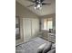 Bright bedroom featuring a closet, light walls, and a comfy bed with lots of pillows at 8260 E Arabian Trl # 275, Scottsdale, AZ 85258