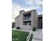 Building exterior featuring balconies, green space and exterior stairs at 8260 E Arabian Trl # 275, Scottsdale, AZ 85258