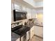 Kitchen featuring updated stainless steel appliances and white cabinetry at 8260 E Arabian Trl # 275, Scottsdale, AZ 85258