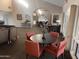 A community lounge area with multiple seating arrangements, tables, and a decorative flower arrangement at 8260 E Arabian Trl # 275, Scottsdale, AZ 85258