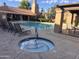 Community pool featuring an attached hot tub, lounge chairs, and clubhouse at 8260 E Arabian Trl # 275, Scottsdale, AZ 85258