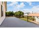 Spacious balcony featuring black metal railings and offering views of the backyard and surrounding neighborhood at 844 W Sherri Dr, Gilbert, AZ 85233