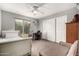 Comfortable bedroom with large closet, chair, and desk with bright window at 844 W Sherri Dr, Gilbert, AZ 85233