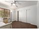 Bright bedroom with light brown carpet, window blinds, ceiling fan and closet at 844 W Sherri Dr, Gilbert, AZ 85233