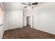 Spacious bedroom featuring brown carpet, closet, doors and white walls at 844 W Sherri Dr, Gilbert, AZ 85233