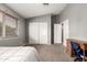 Bedroom showcasing a large window, closet doors, neutral walls, and carpet, perfect for customization at 844 W Sherri Dr, Gilbert, AZ 85233