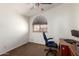 Bedroom featuring brown carpet, a window with blinds, and a blue chair at 844 W Sherri Dr, Gilbert, AZ 85233