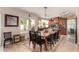Dining area features a large table with seating for six and a view of the backyard through a large window at 844 W Sherri Dr, Gilbert, AZ 85233