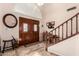 Spacious foyer with double doors, a staircase, and decorative tile flooring at 844 W Sherri Dr, Gilbert, AZ 85233