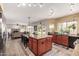 Open kitchen features a large center island with seating, and a view into the living area at 844 W Sherri Dr, Gilbert, AZ 85233