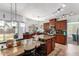 Open kitchen with granite counters, wood cabinets, tile floors, recessed lighting, and large island at 844 W Sherri Dr, Gilbert, AZ 85233