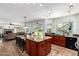 Bright kitchen with a large island, granite countertops, and tile flooring at 844 W Sherri Dr, Gilbert, AZ 85233