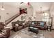 Spacious living room with vaulted ceilings, ceiling fans, and a grand staircase at 844 W Sherri Dr, Gilbert, AZ 85233