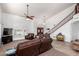 Spacious living area featuring high ceilings, large windows, and an adjacent staircase at 844 W Sherri Dr, Gilbert, AZ 85233