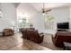 Bright living room with high ceilings, large windows, tile entry, and comfortable seating at 844 W Sherri Dr, Gilbert, AZ 85233