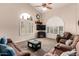 Comfortable living room with vaulted ceilings, ceiling fan, and plush seating at 844 W Sherri Dr, Gilbert, AZ 85233