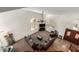 Bright living room featuring high ceilings, a ceiling fan, an entertainment center, and large windows with plantation shutters at 844 W Sherri Dr, Gilbert, AZ 85233