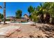 Backyard featuring a private pool with lounge chairs, a rock waterfall, and drought tolerant landscaping at 844 W Sherri Dr, Gilbert, AZ 85233