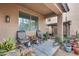 Back patio featuring multiple chairs with lots of greenery and shade at 9364 W Cordes Rd, Tolleson, AZ 85353