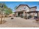 Large gravel backyard with a covered patio area, fire pit, and plenty of room at 9364 W Cordes Rd, Tolleson, AZ 85353