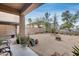 A spacious backyard featuring drought-resistant landscaping and a covered patio at 9364 W Cordes Rd, Tolleson, AZ 85353
