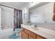 Bathroom features single sink vanity, toilet, and shower-tub combo with curtain at 9364 W Cordes Rd, Tolleson, AZ 85353