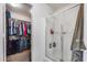Modern bathroom features glass-enclosed shower and walk-in closet for ample storage at 9364 W Cordes Rd, Tolleson, AZ 85353