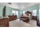 Spacious bedroom with two dressers, large bed, and plenty of natural light at 9364 W Cordes Rd, Tolleson, AZ 85353