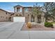 Charming two-story home with a two-car garage and a well-maintained front yard at 9364 W Cordes Rd, Tolleson, AZ 85353