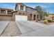 Lovely two-story home showcasing a two-car garage and manicured front yard at 9364 W Cordes Rd, Tolleson, AZ 85353