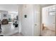 Inviting hallway featuring tile flooring, leading to the bathroom and living area with natural light at 9364 W Cordes Rd, Tolleson, AZ 85353