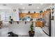 Well-lit kitchen with stainless steel appliances and ample cabinet space for storage at 9364 W Cordes Rd, Tolleson, AZ 85353