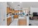 Kitchen featuring stainless steel appliances, wooden cabinetry, and a tiled floor at 9364 W Cordes Rd, Tolleson, AZ 85353