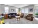 Cozy living room offers comfortable seating, ample natural light, and neutral walls at 9364 W Cordes Rd, Tolleson, AZ 85353