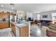 Open-concept layout seamlessly connects the kitchen and living room, perfect for entertaining at 9364 W Cordes Rd, Tolleson, AZ 85353