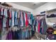 Organized walk-in closet with shelving, hanging rods, and ample storage space at 9364 W Cordes Rd, Tolleson, AZ 85353