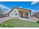 This home boasts a cozy covered patio and an easy-to-maintain backyard with gravel, turf, and a privacy fence at 9837 W Tonopah Dr, Peoria, AZ 85382