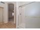 Bathroom with a glass shower, light colored tile flooring and neutral colored walls at 9837 W Tonopah Dr, Peoria, AZ 85382