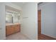 Bathroom featuring a vanity, tile floors, and an open doorway to the next room at 9837 W Tonopah Dr, Peoria, AZ 85382