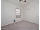 Bedroom with neutral colored walls and carpet and a window with blinds at 9837 W Tonopah Dr, Peoria, AZ 85382