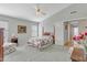 Comfortable bedroom featuring a ceiling fan, carpet, and ensuite bathroom at 9837 W Tonopah Dr, Peoria, AZ 85382