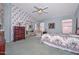Charming bedroom with floral accents, ample natural light, and a mirrored closet at 9837 W Tonopah Dr, Peoria, AZ 85382