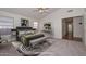 Bright bedroom with a plush rug, vaulted ceiling, and neutral tones, creating a serene and inviting space at 9837 W Tonopah Dr, Peoria, AZ 85382