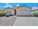 Charming single-story home with stucco exterior, red tile roof and low-maintenance desert landscaping at 9837 W Tonopah Dr, Peoria, AZ 85382