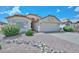 Inviting single-story home with a well-maintained desert landscape and red tile roofing at 9837 W Tonopah Dr, Peoria, AZ 85382