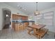 Traditional kitchen area with wood cabinets, blue countertops, and a cozy breakfast nook at 9837 W Tonopah Dr, Peoria, AZ 85382