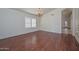 Inviting living area with wood floors, plantation shutters, and access to other rooms at 9837 W Tonopah Dr, Peoria, AZ 85382
