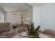 Open living room with wood floors, modern decor, and a dining area visible in a bright, staged space at 9837 W Tonopah Dr, Peoria, AZ 85382